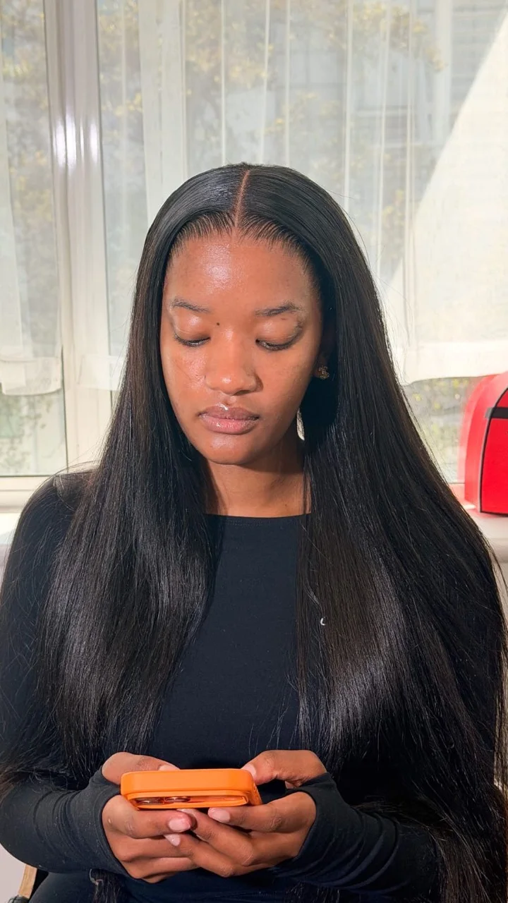 Sleek long hair with a seamless centre part